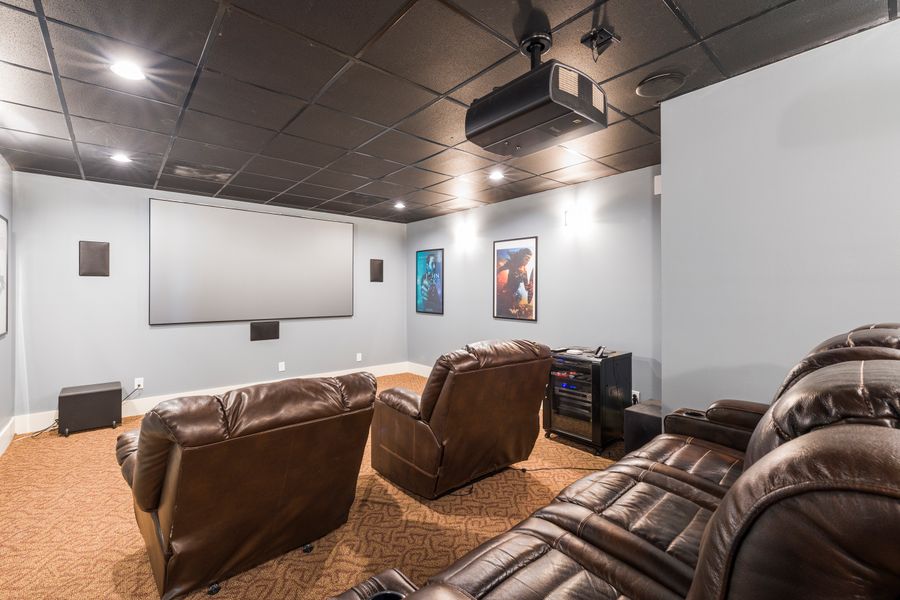 Video analysis room with a large screen and seating.